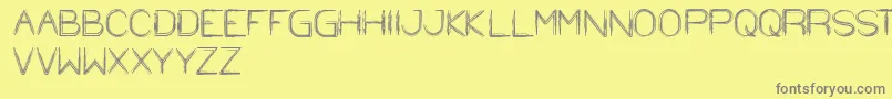 StrawHat-fontti – harmaat kirjasimet keltaisella taustalla