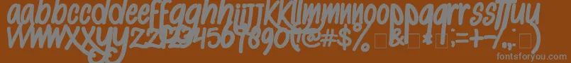 AlKisah Font – Gray Fonts on Brown Background