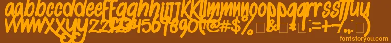 AlKisah-Schriftart – Orangefarbene Schriften auf braunem Hintergrund