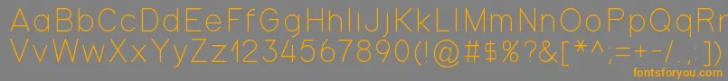 フォントGondola – オレンジの文字は灰色の背景にあります。
