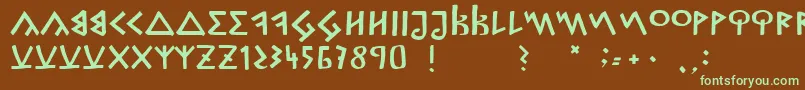 フォントCapitalisGoreanis – 緑色の文字が茶色の背景にあります。