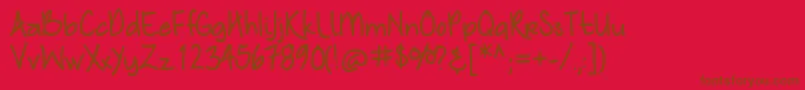 Fonte Nymphshandwriting – fontes marrons em um fundo vermelho