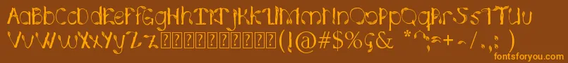 フォントHojasPlata0.2 – オレンジ色の文字が茶色の背景にあります。