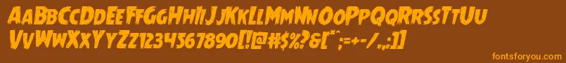 フォントMrsmonsterital – オレンジ色の文字が茶色の背景にあります。