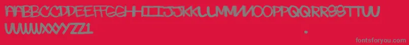 フォントSkratchie – 赤い背景に灰色の文字