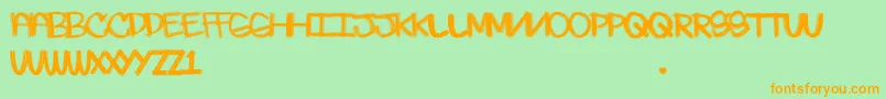 フォントSkratchie – オレンジの文字が緑の背景にあります。
