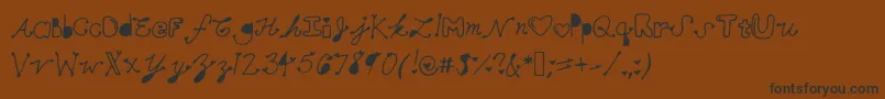 フォントMollymfont – 黒い文字が茶色の背景にあります