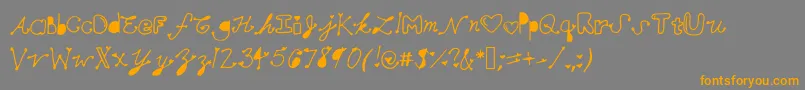 フォントMollymfont – オレンジの文字は灰色の背景にあります。