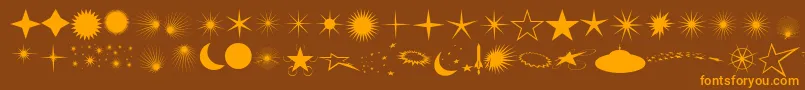 フォントFcoflares – オレンジ色の文字が茶色の背景にあります。