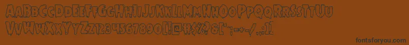 Mrsmonsterboldout Font – Black Fonts on Brown Background