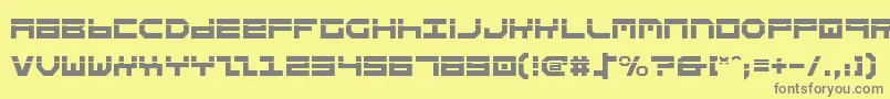 フォントStuntv2l – 黄色の背景に灰色の文字