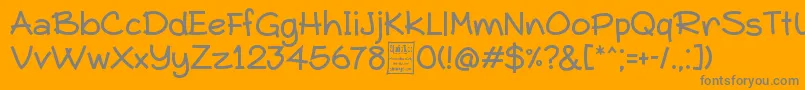 Czcionka TypoComicaDemo – szare czcionki na pomarańczowym tle