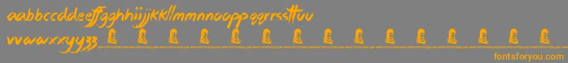 フォントStickyThings – オレンジの文字は灰色の背景にあります。