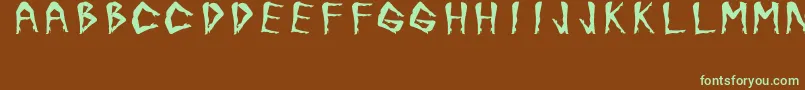 フォントJuanjoSHotLegsBold – 緑色の文字が茶色の背景にあります。