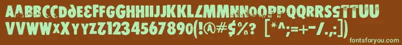 Ds Stamper-Schriftart – Grüne Schriften auf braunem Hintergrund