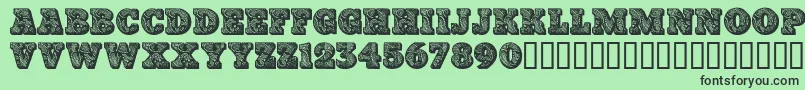 Paisleycaps Font – Black Fonts on Green Background