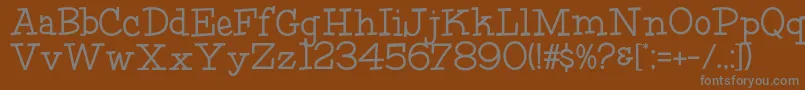 HffFourthRock-fontti – harmaat kirjasimet ruskealla taustalla