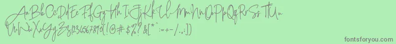 フォントPinkScriptR1 – 緑の背景に灰色の文字