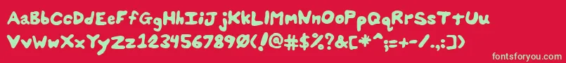 SplatsUnsplatted-Schriftart – Grüne Schriften auf rotem Hintergrund
