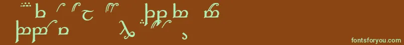 フォントElficaa – 緑色の文字が茶色の背景にあります。