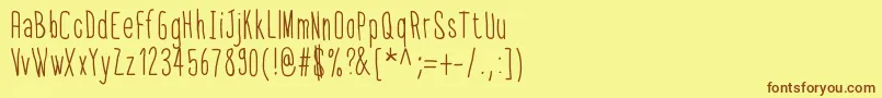 フォントThinfont – 茶色の文字が黄色の背景にあります。