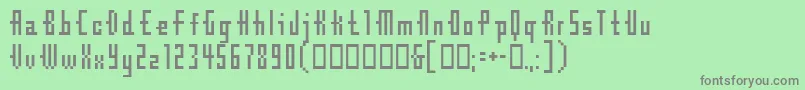 Cubebitmap12point-fontti – harmaat kirjasimet vihreällä taustalla