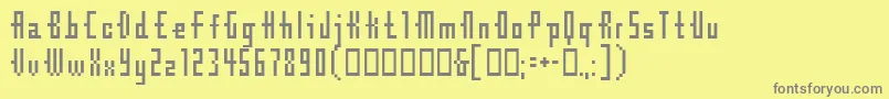 Cubebitmap12point-fontti – harmaat kirjasimet keltaisella taustalla