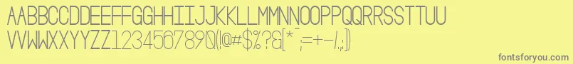 OsloIiBold-fontti – harmaat kirjasimet keltaisella taustalla