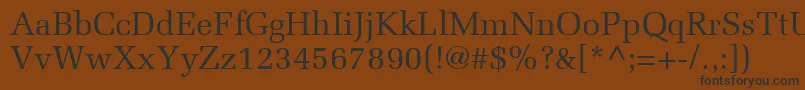 フォントMeliorLt – 黒い文字が茶色の背景にあります