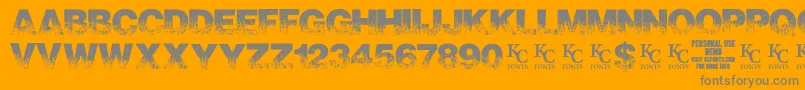 ScorchedearthdemoKcfonts-Schriftart – Graue Schriften auf orangefarbenem Hintergrund