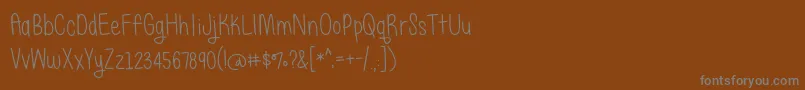 Шрифт BmdJustAlice – серые шрифты на коричневом фоне