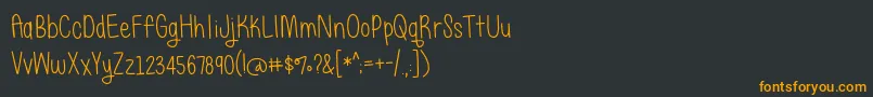 Czcionka BmdJustAlice – pomarańczowe czcionki na czarnym tle