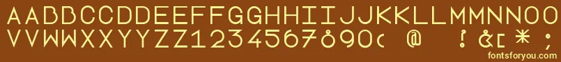 Lottepaperfang-fontti – keltaiset fontit ruskealla taustalla
