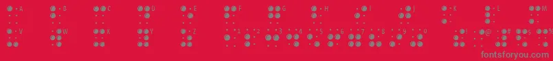 Braillelatin-fontti – harmaat kirjasimet punaisella taustalla