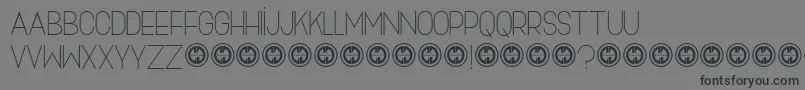 Skinnyjeans-fontti – mustat fontit harmaalla taustalla