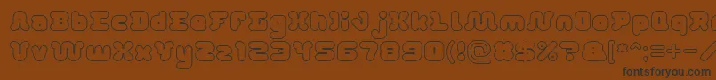 DayDreamerHollow-fontti – mustat fontit ruskealla taustalla