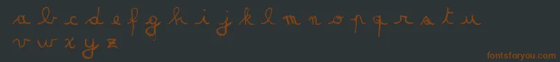 Czcionka MatildasGradeSchoolHandDemoScript – brązowe czcionki na czarnym tle
