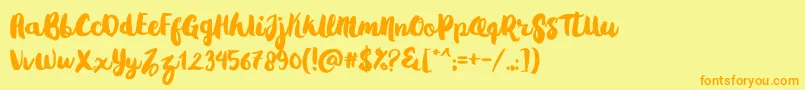 フォントGradies – オレンジの文字が黄色の背景にあります。