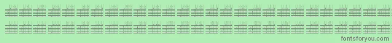 Fonte L25q – fontes cinzas em um fundo verde