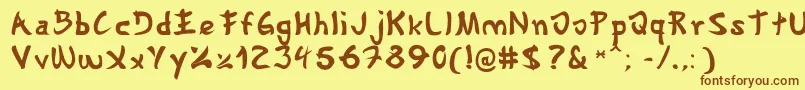 フォントGyosho – 茶色の文字が黄色の背景にあります。