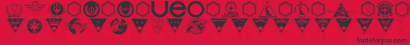 フォントBeneathTheSurfaceDingbats – 赤い背景に黒い文字