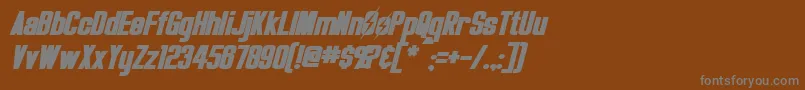 OverseerBoldItalic-fontti – harmaat kirjasimet ruskealla taustalla