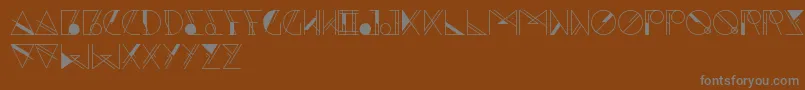 Aesthetika-fontti – harmaat kirjasimet ruskealla taustalla