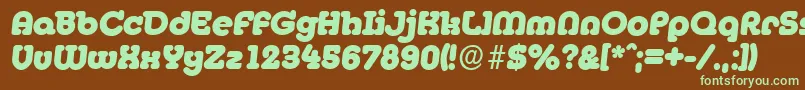 フォントMexicoserialHeavyItalic – 緑色の文字が茶色の背景にあります。