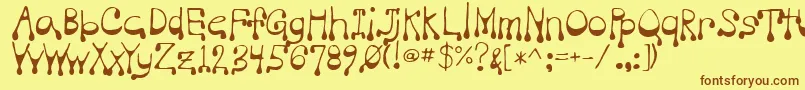 フォントVampire – 茶色の文字が黄色の背景にあります。