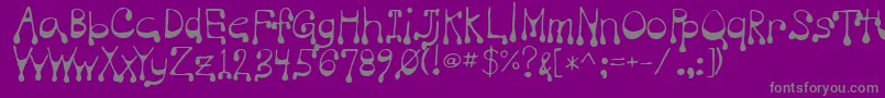 Vampire-fontti – harmaat kirjasimet violetilla taustalla