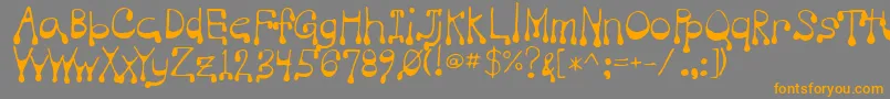 フォントVampire – オレンジの文字は灰色の背景にあります。