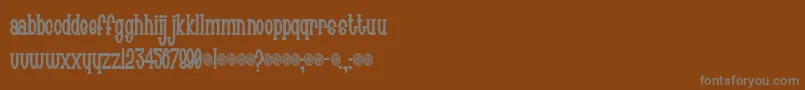 フォントChachie – 茶色の背景に灰色の文字