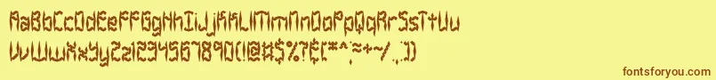 フォントZirconiaBrk – 茶色の文字が黄色の背景にあります。