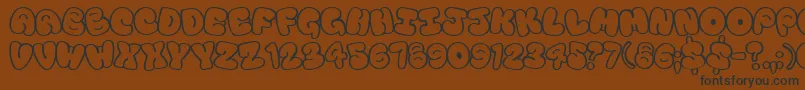 Tourist Font – Black Fonts on Brown Background
